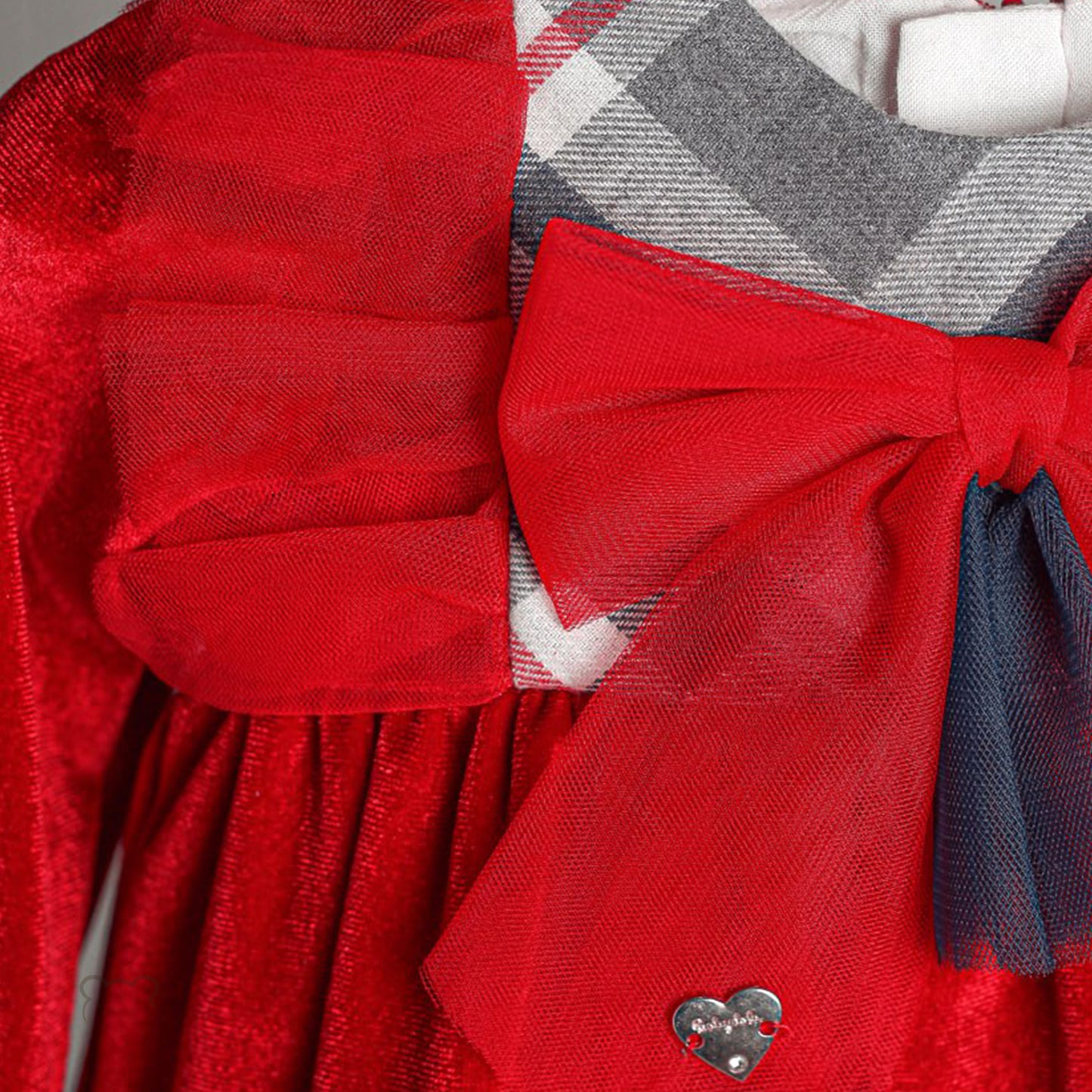 Red Tartan Baby Girl dress with frill details.